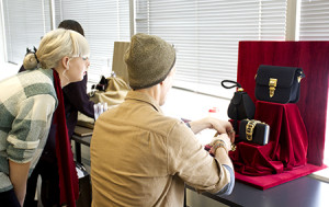 First term students in the Toronto Film School's Marketing for Fashion & Entertainment Diploma Program get a lesson in Visual Merchandising from their skilled instructor. 