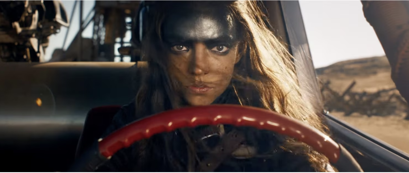 mage of Anya Taylor- Joy driving car in Mad Max: Furiosa.