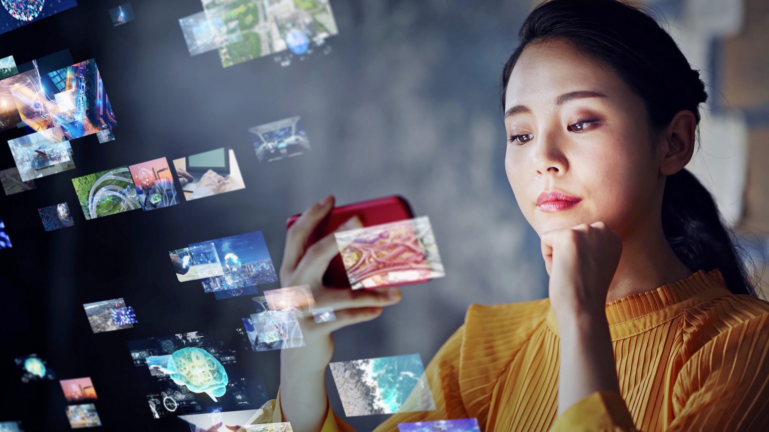 Woman selecting from a variety of short films to watch on her mobile phone. 