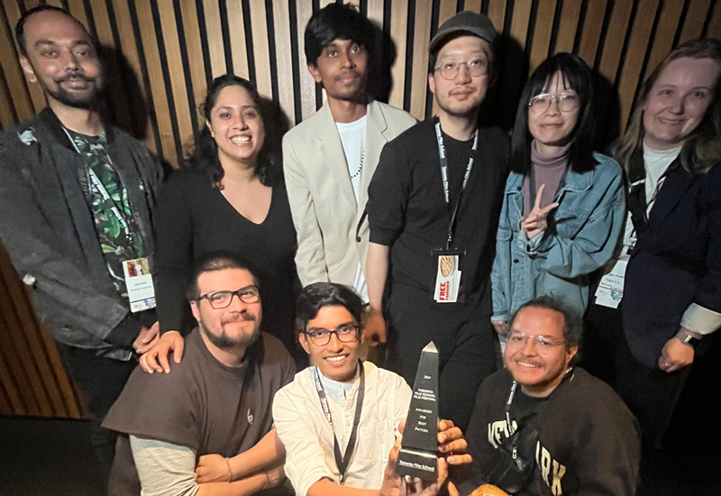 Han Liu (top, fourth from left) and his TFS crew celebrate 'Congratulations, It's a Girl's award wins at TFS FEST 2024. 