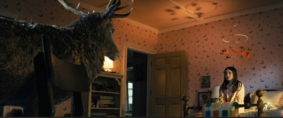  Deer visits young Margaret in her room, in a flashback sequence in Spielberg's Disclosure Day. Movie review by Garry Murdock.